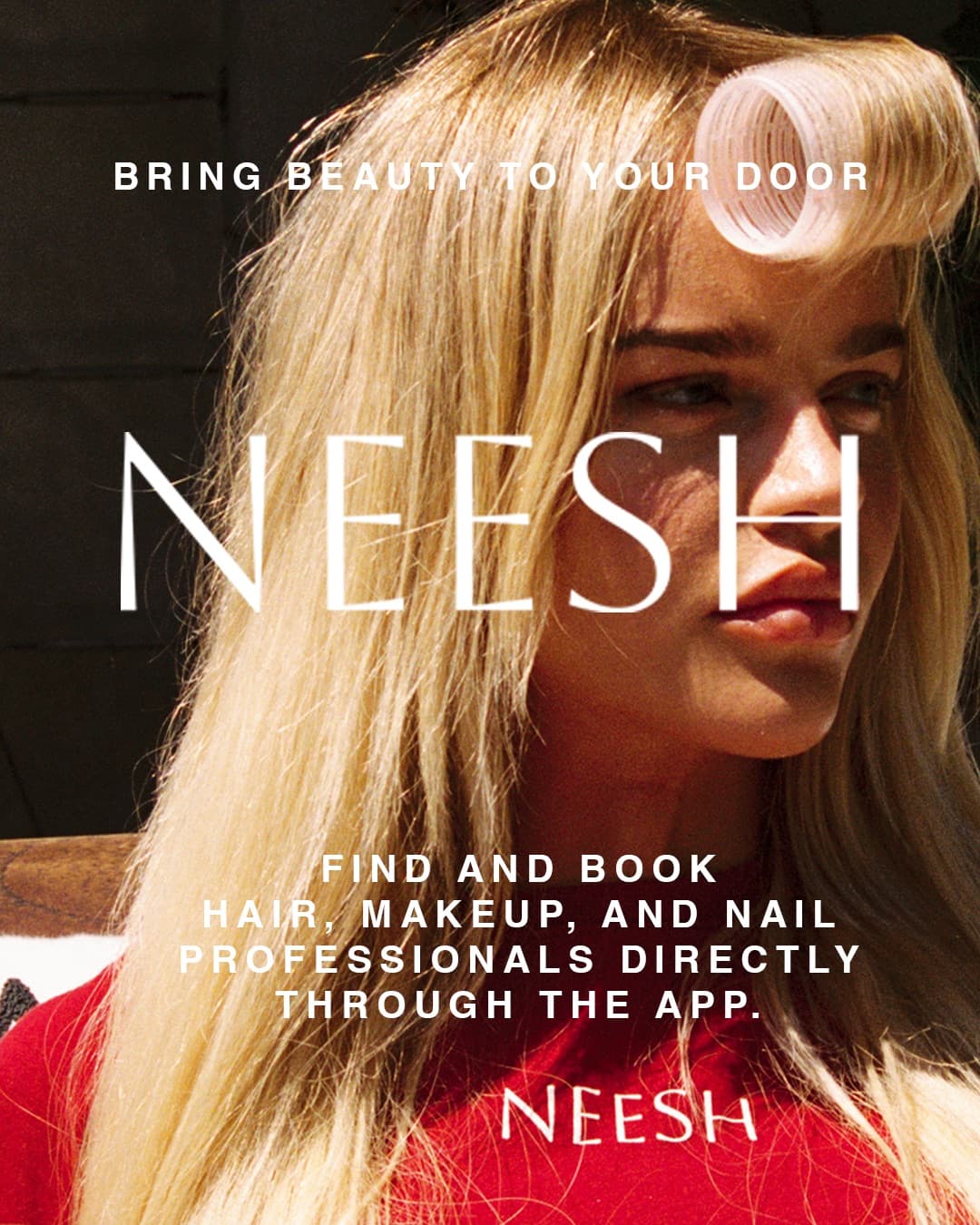Neesh campaign poster: a model with a hair roller in her fringe, under the line “Bring beauty to your door”.